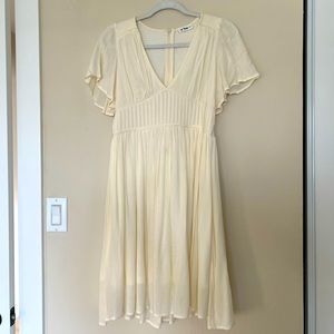 Cream knee length dress with flutter sleeves
